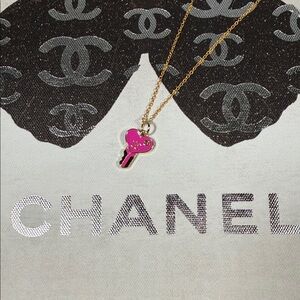 Beautiful Upcycled Chanel pink and gold key on 18” chain.